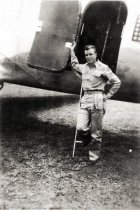Soldier at cargo door of airplane